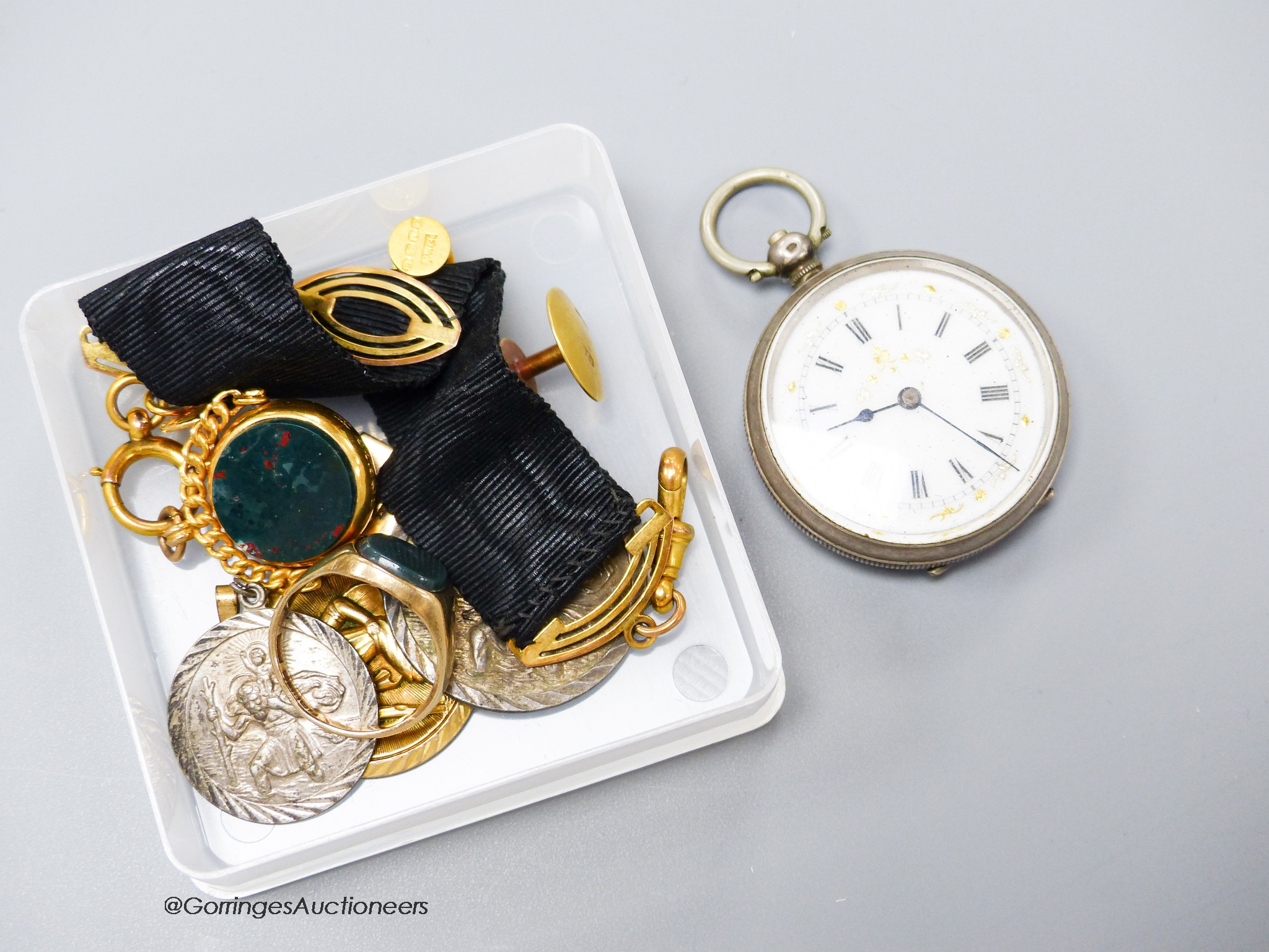 A 1960's 9ct gold and bloodstone set signet ring, size O, a Victorian 9ct gold and chalcedony set swivelling fob seal on a 9ct mounted black sash suspension, a 9ct ingot pendant, (9ct gross 21.3 grams), two 18ct dress st